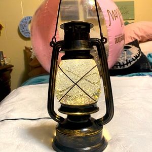 A Cracker Barrel lantern that plugs in and lights up so beautifully.